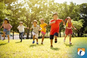 Westcliff Early Learning Academy, Children running in grass, gross motor skills development